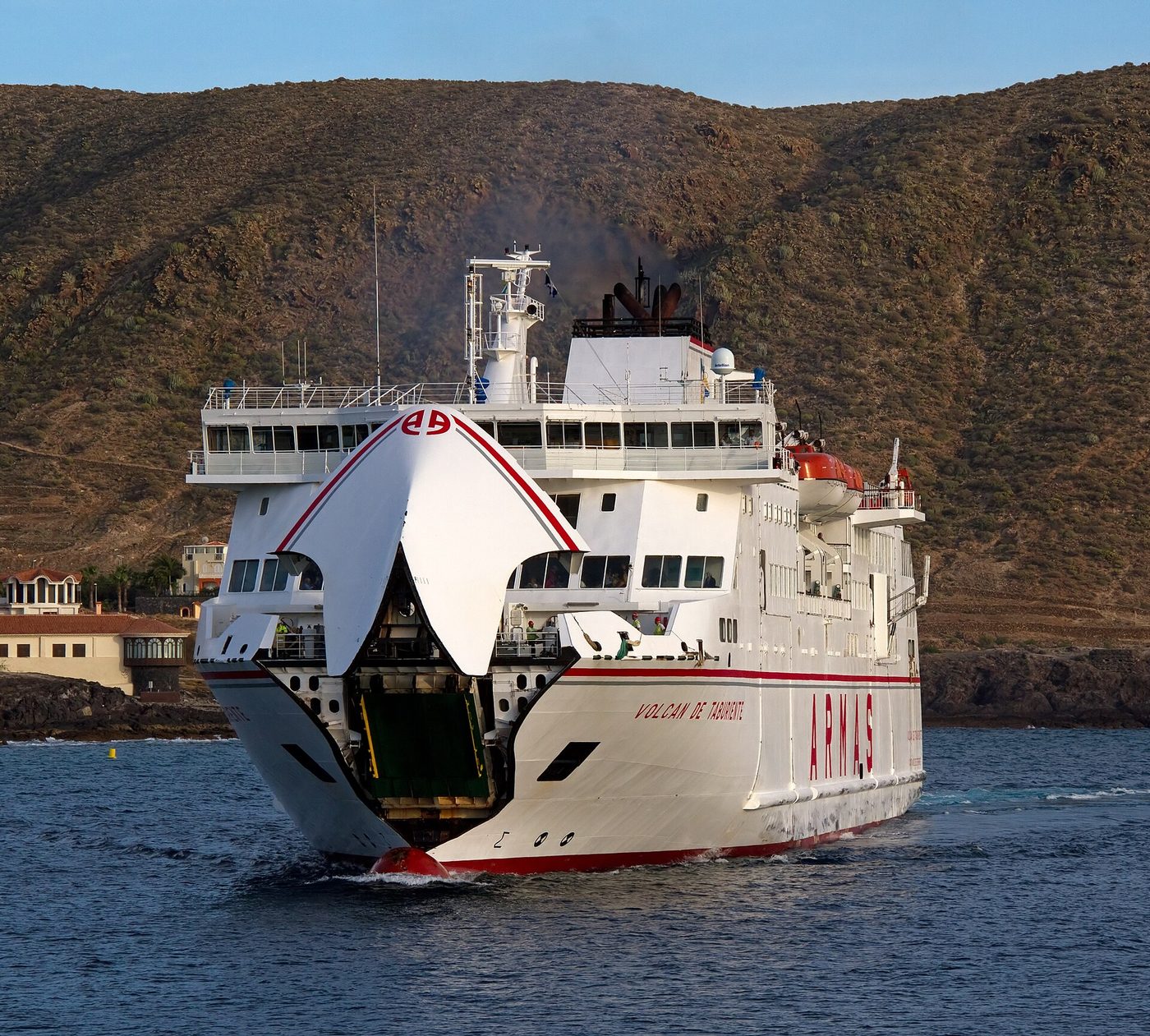 A ferry in the harbour of Los Cristianos, with the Montaña de Guaza behind