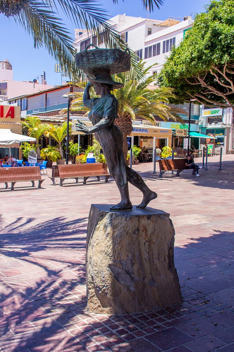 A bronze fisherwoman on the seafront